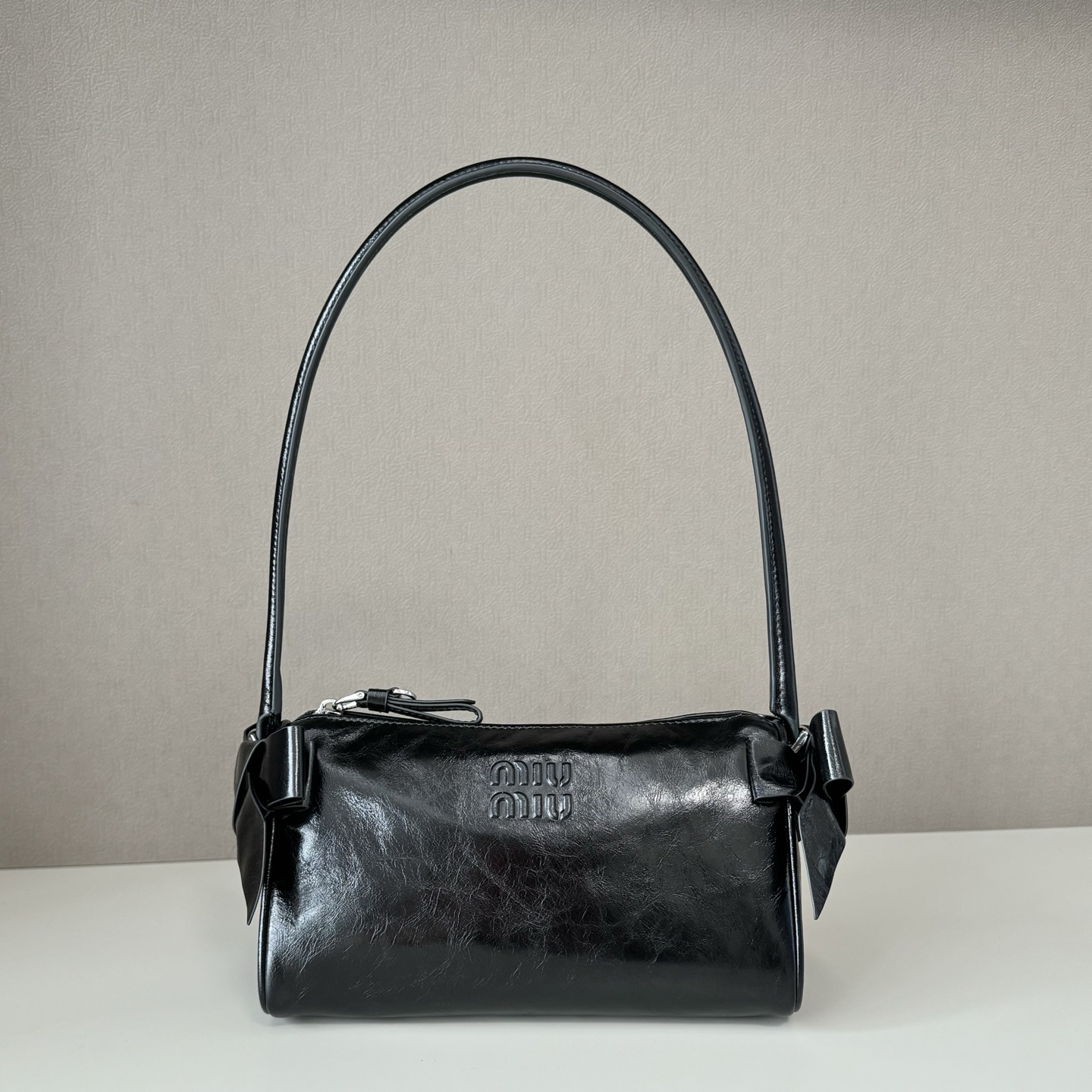 Miu Miu side bow waxed leather underarm bag